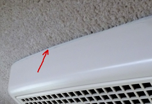 Weather stripping added around air conditioner to keep air intake from making black streaks on carpet